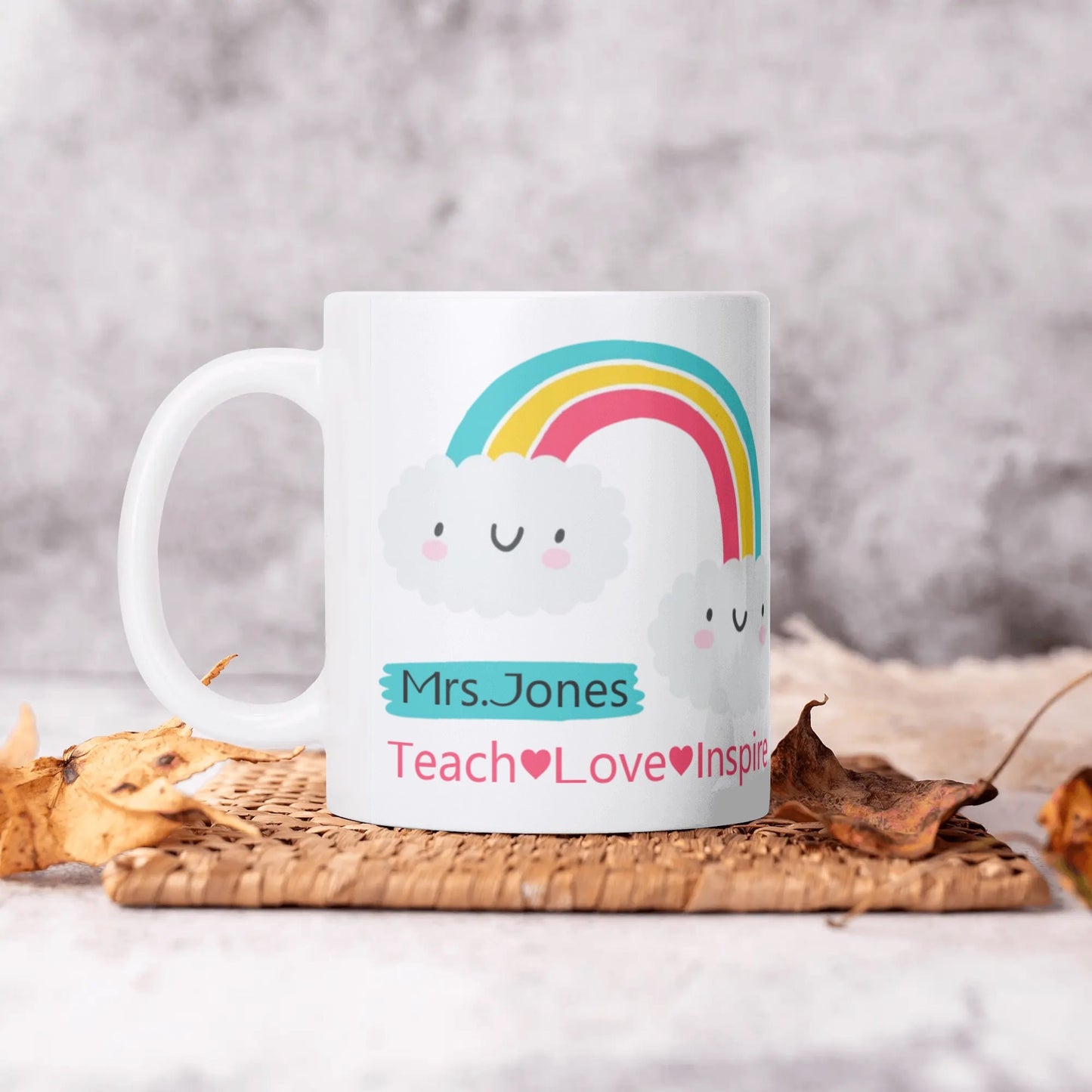 Mug with rainbow design and text on a textured surface