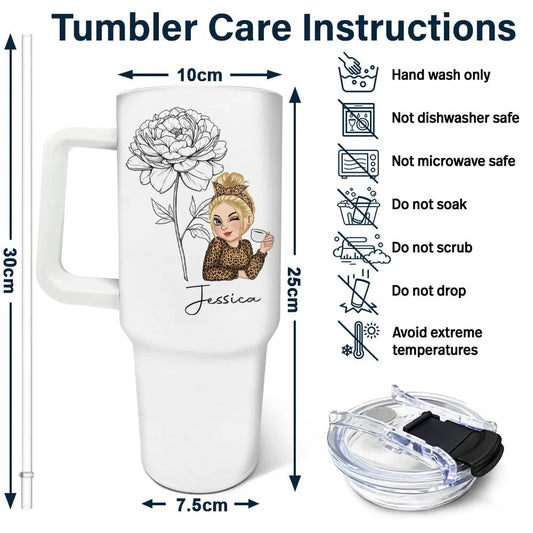 Close-up of custom cartoon tumbler with flower illustration and name engraving