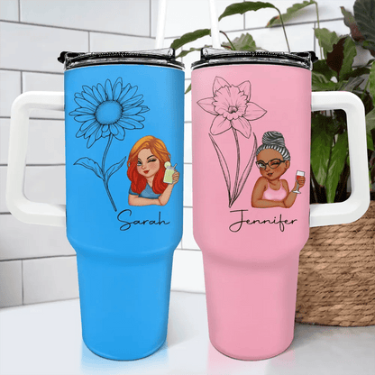 Close-up of custom cartoon tumbler with flower illustration and name engraving