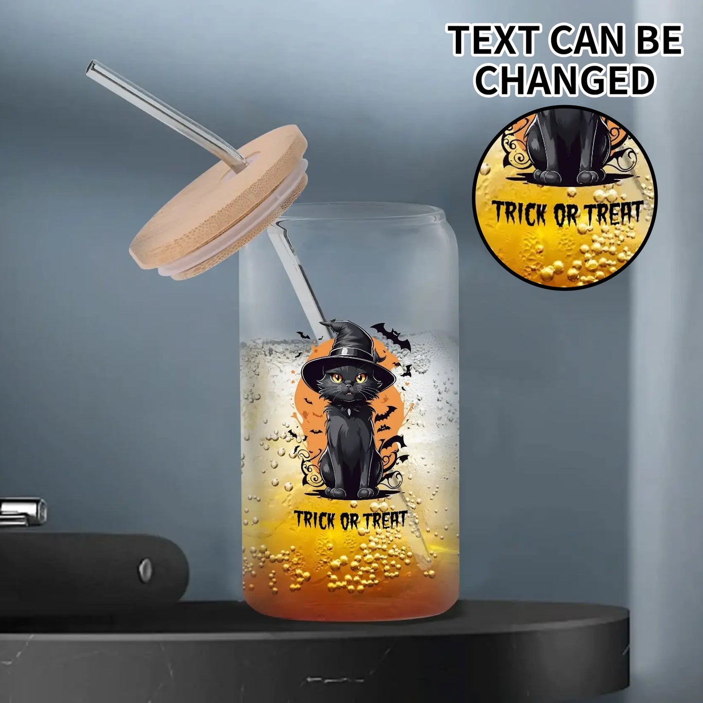 Personalized black cat Halloween tumbler with bamboo lid and glass straw, featuring a spooky “Trick or Treat” design, perfect for seasonal drinks.