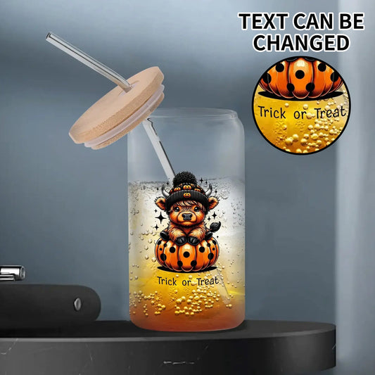 16oz Halloween glass tumbler with cute bear sitting on a pumpkin, customizable text “Trick or Treat,” bamboo lid and glass straw, eco-friendly Halloween drinkware.