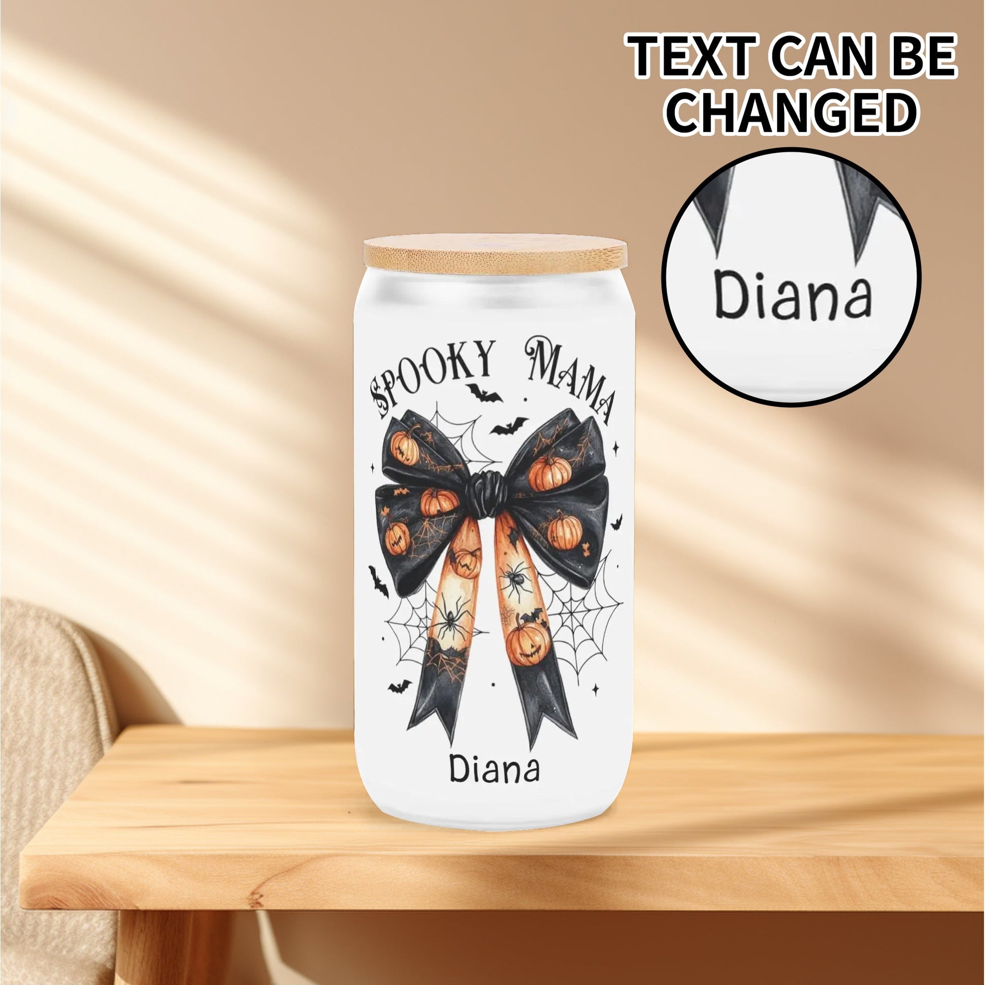 Spooky Mama personalized Halloween tumbler with pumpkin bow, spider webs, and bats, customized with name under design, bamboo lid included.