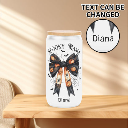 Spooky Mama personalized Halloween tumbler with pumpkin bow, spider webs, and bats, customized with name under design, bamboo lid included.