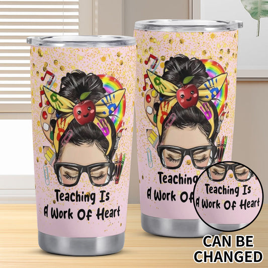 Teaching Is A Work of Heart tumbler with rainbow messy bun teacher design, apple, pencils, and glitter background.